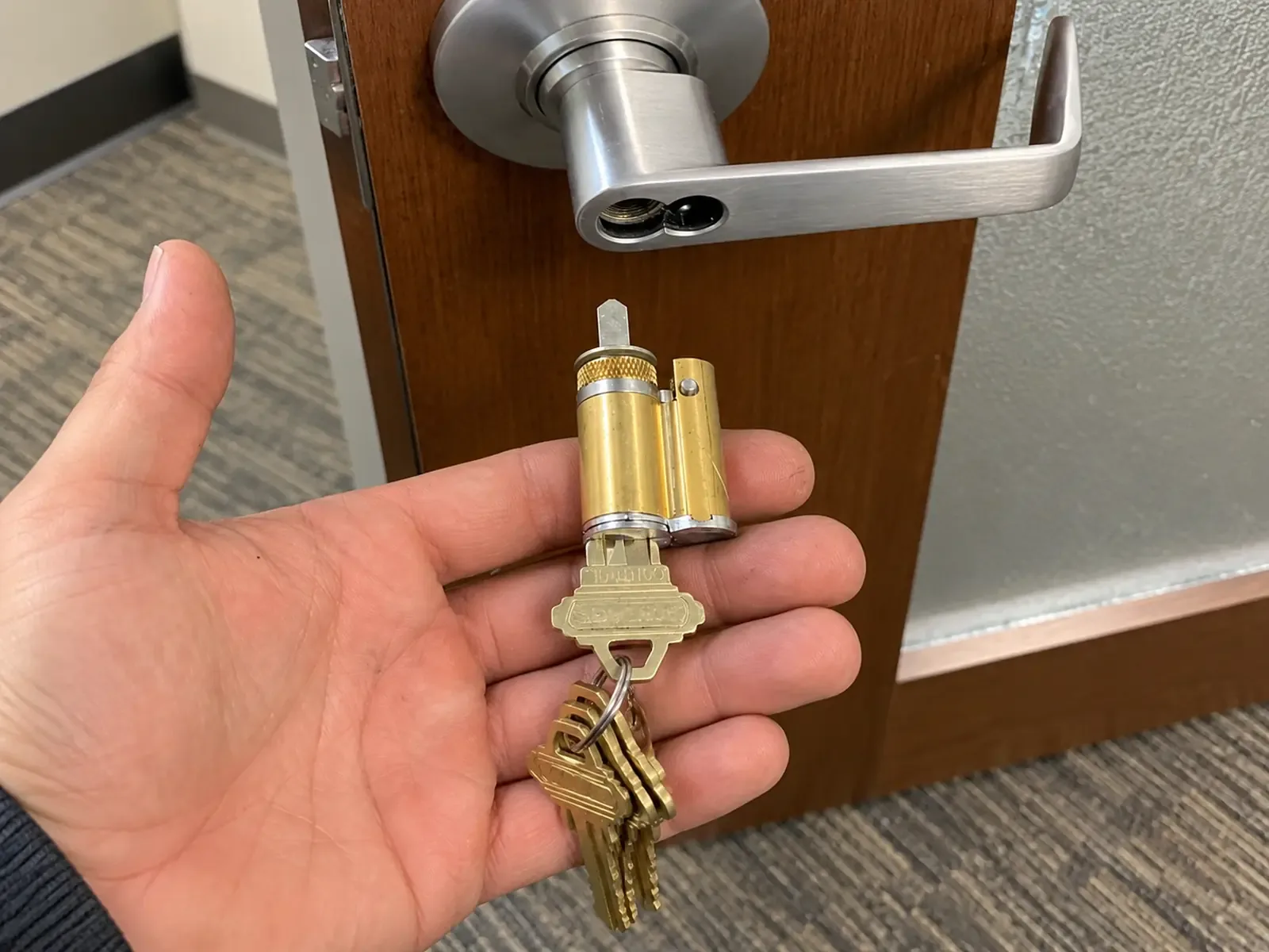 Commercial lever lock rekeyed with a new set of keys