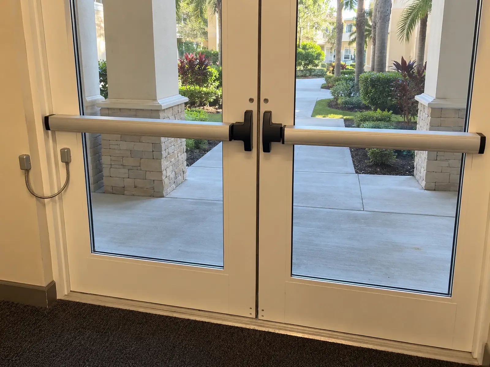 Panic bars installed on double glass exit doors