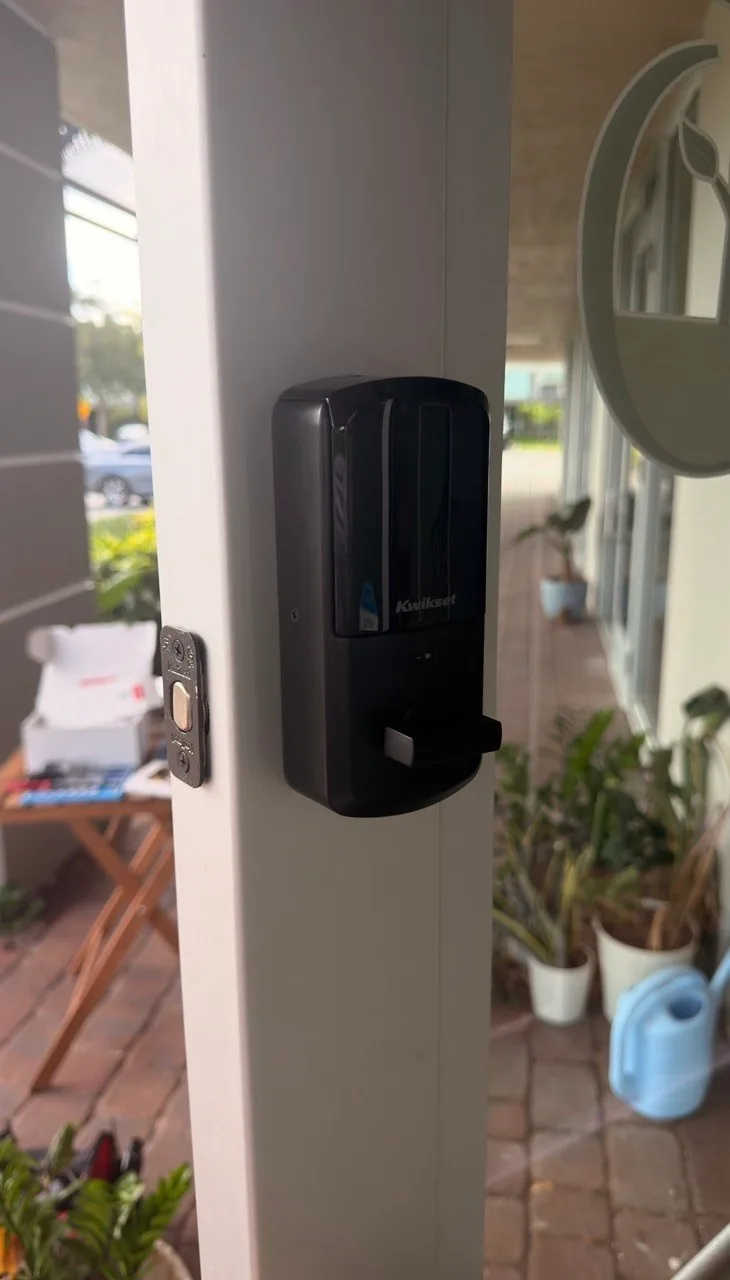 Kwikset smart deadbolt installed on a storefront door